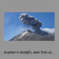 eruption in daylight, seen from camp
